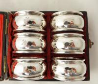 BOXED SET OF SILVER NAPKIN RINGS